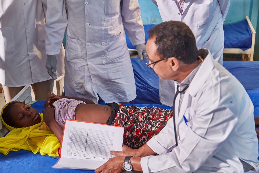 Kala azar patient being examined by doctors in Dooka, Sudan